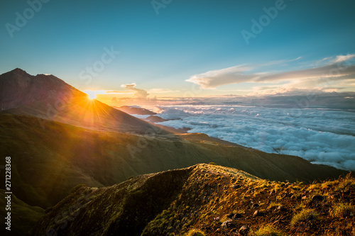 Sunrise on the clouds below Mount Rinjani, Lombok, Indonesia