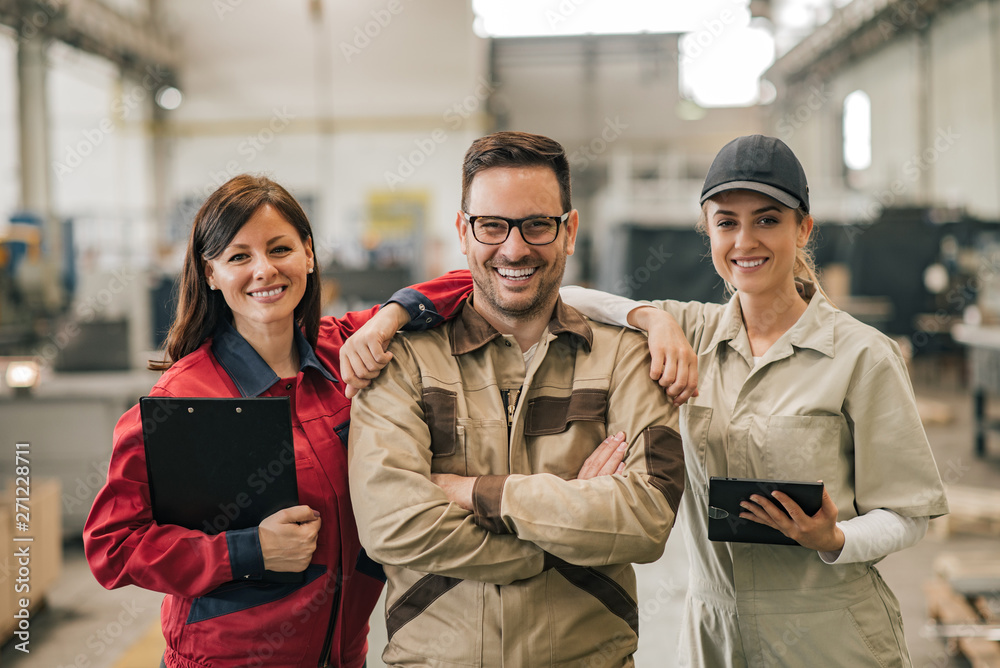 Group portrait of a team of engineers at heavy industry. Group portrait of a team of engineers at heavy industry.