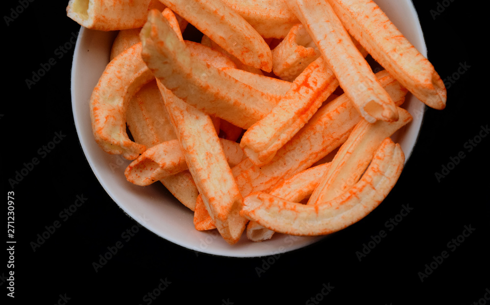 Sweet and delicious savory snacks from Indonesia, these foods are often served for snacks. snack on a plate with a blank black background