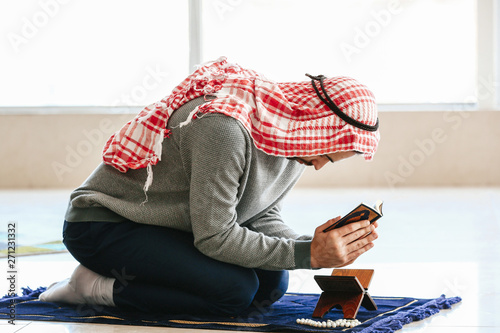 Muslim Man Reading Holy Qur...