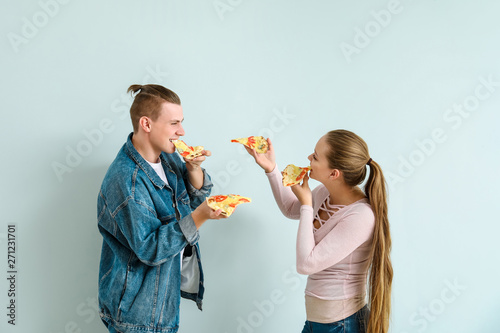Young couple eating tasty p...