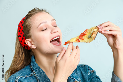 Beautiful woman eating tast...