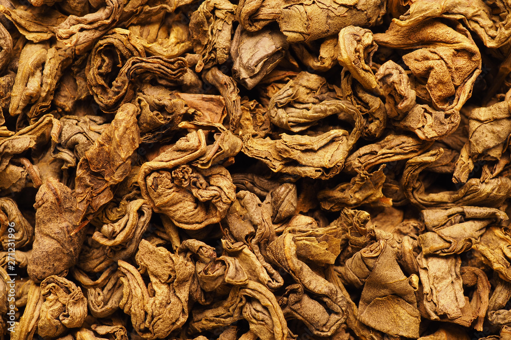 Dried tea leaves closeup. Shot in warm colors on a macro lens Dried tea leaves closeup. Shot in warm colors on a macro lens