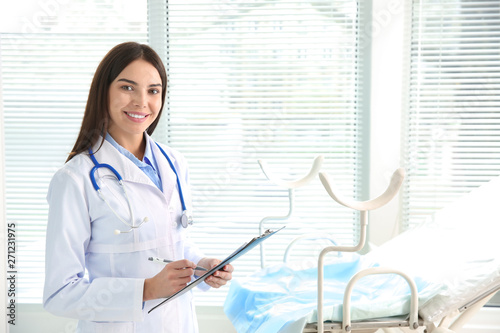 Beautiful female gynecologist in clinic photo