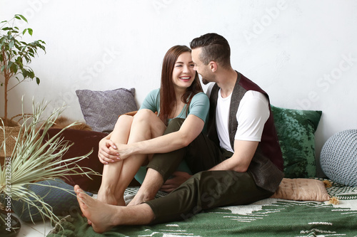 Happy couple resting at home