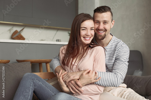 Happy couple resting at home