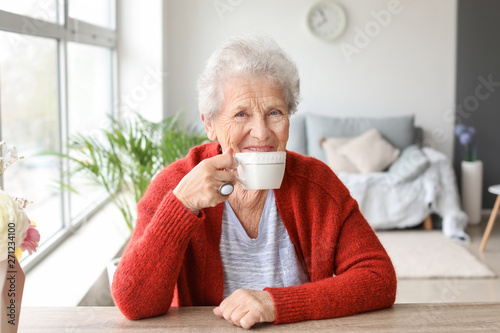 Senior woman drinking tea a...