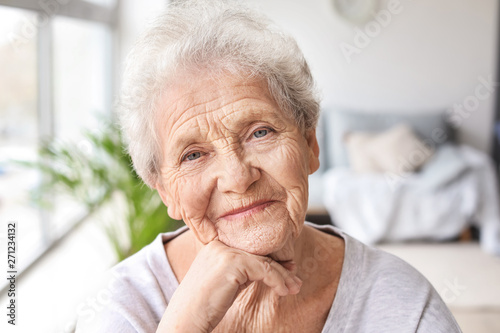 Portrait of senior woman at home photo
