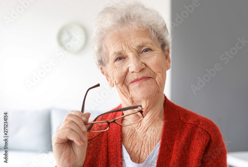 Portrait of senior woman at home photo