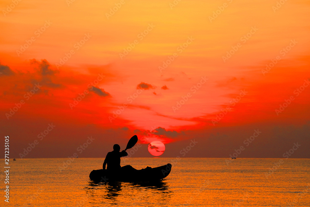 silhouette Kayaker in the sea on sunrise