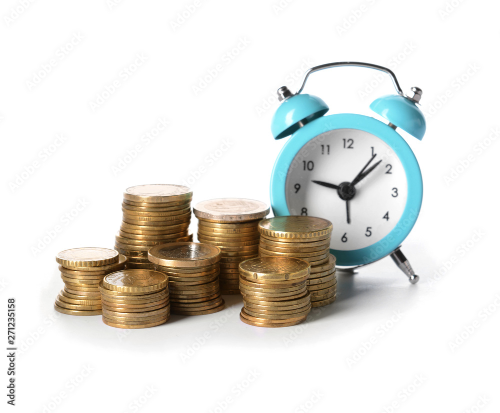 Alarm clock with coins on white background. Money savings concept Alarm clock with coins on white background. Money savings concept