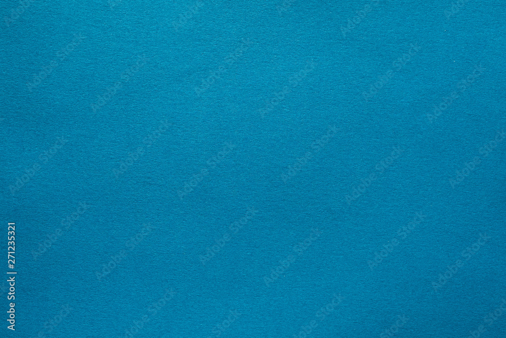 Light teal blue felt texture abstract art background. Solid color wool textile. Copy space.