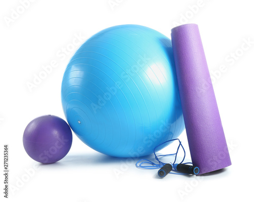 Set of sports equipment with fitness ball on white background photo