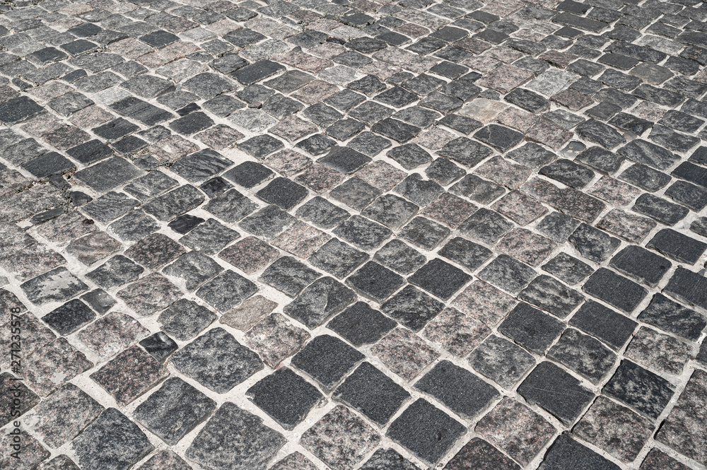 Stone road lined with stone blocks street. The texture of masonry stone. Stone road lined with stone blocks street. The texture of masonry stone.