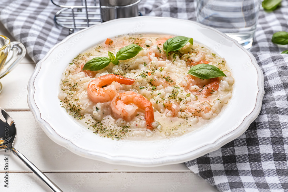 Plate with tasty risotto on table Plate with tasty risotto on table