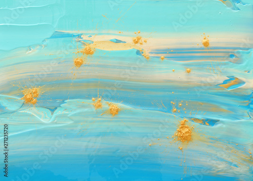 photography of abstract marbleized effect background. Blue, mint and white creative colors. Beautiful paint with the addition of gold.