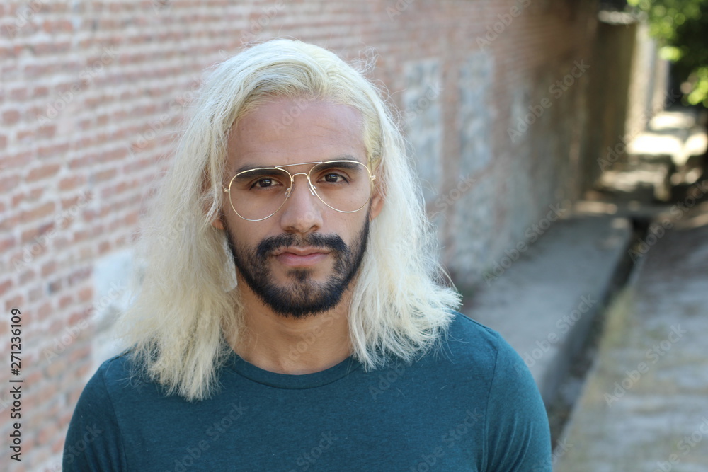 Ethnic man with blonde dyed long hairstyle  - obrazy, fototapety, plakaty 
