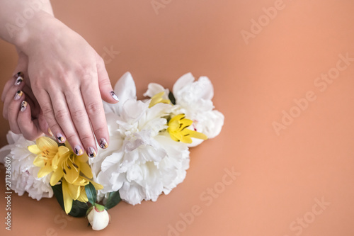 Closeup view of woman with beautiful hands on color background, space for text