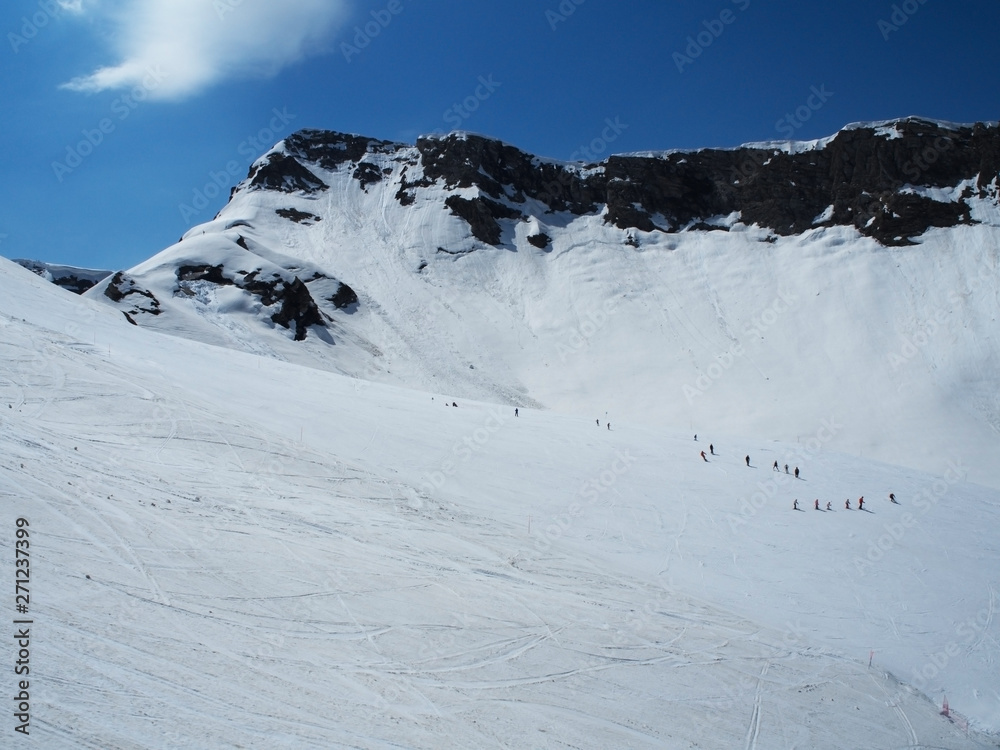 Rocky Mountains ski resort Gorky-gorod. Skiers on the mountain. Russia Sochi 05.11.2019