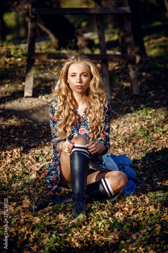 Outdoor fall portrait of girl with hat and jeans wear.