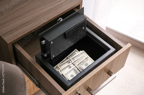 Modern safe with money in drawer