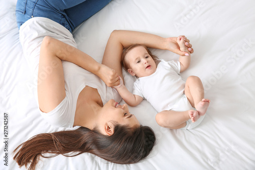 Happy mother with cute litt...