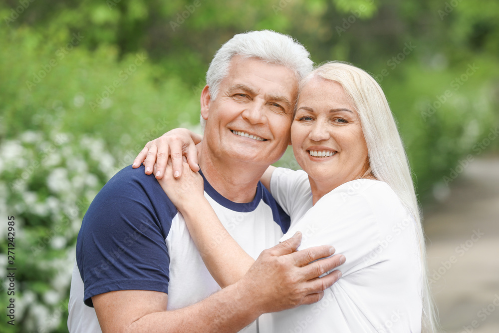 Portrait of happy mature couple in park Portrait of happy mature couple in park