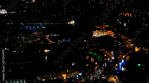 Night panorama view of Tbilisi capital of Georgia country. Dark streets with illumination and moving cars lights. photo