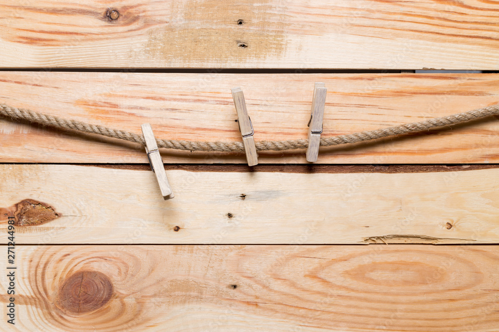 clothespins on old wooden background