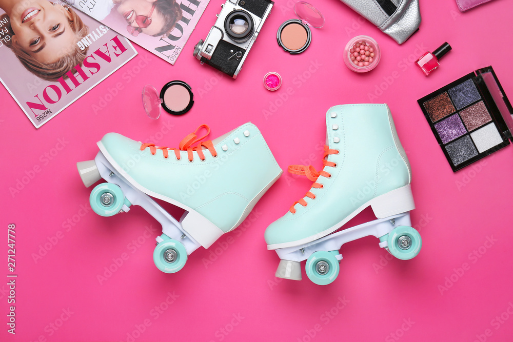 Composition with vintage roller skates, cosmetics and accessories on color  background Stock Photo | Adobe Stock