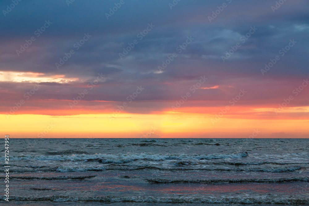 sunset over the baltic sea with cloudscape