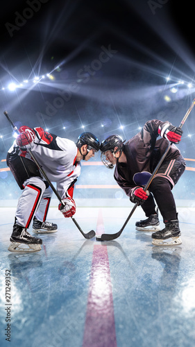 Hockey players starts game around ice arena 