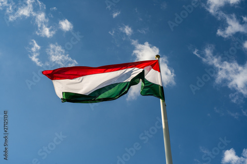 Photography Hungarian hungary national red white green flag in the wind over blue coludy sky