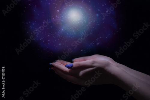 Magic light in palm, stardust and magic in your hands, stars and space