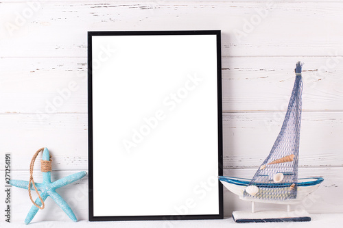 Empty  black frame mockup  with copy space and  summer sea vacation  decorations