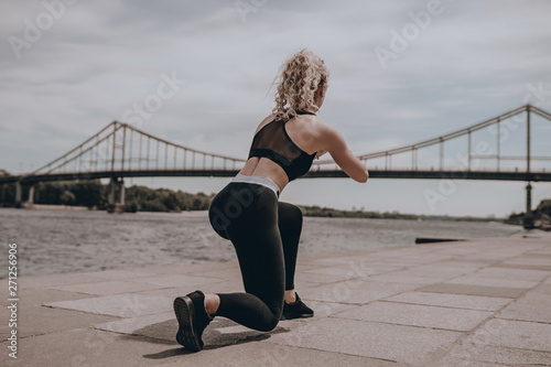 Girl sport fitness. Fit woman city. Female outdoor. Healthy lifestyle. Workout. Young athlete exercise. Strong body. Motivation
