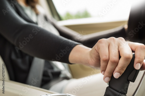 Woman's hand on gear shifter