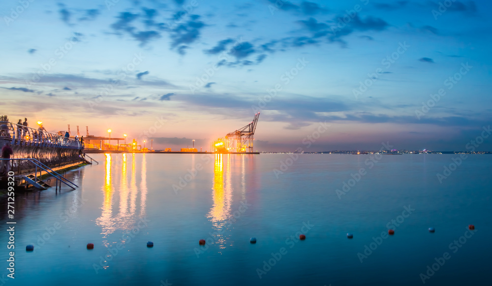 Night view of the container terminal. Commercial port, City Odessa, Ukraine, June 2019. Night Lights. Night view of the container terminal. Commercial port, City Odessa, Ukraine, June 2019. Night Lights.