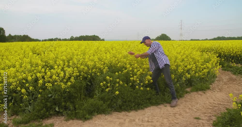 Mature Male Farmer Writing On Clipboard At Farm. Modern Agriculture Mature Male Farmer Writing On Clipboard At Farm. Modern Agriculture