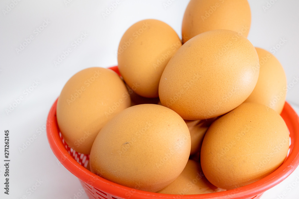 eggs isolated on white background on red basket eggs isolated on white background on red basket