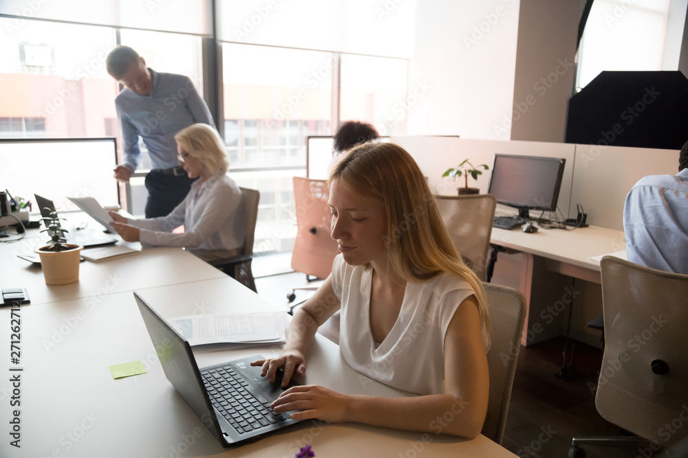 Business people working in modern office, using computers, busy workday Business people working in modern office, using computers, busy workday