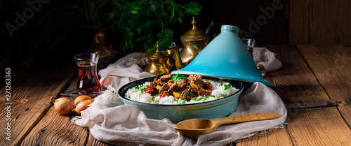 Tajin beef stew with rice paprika and sesame seeds photo