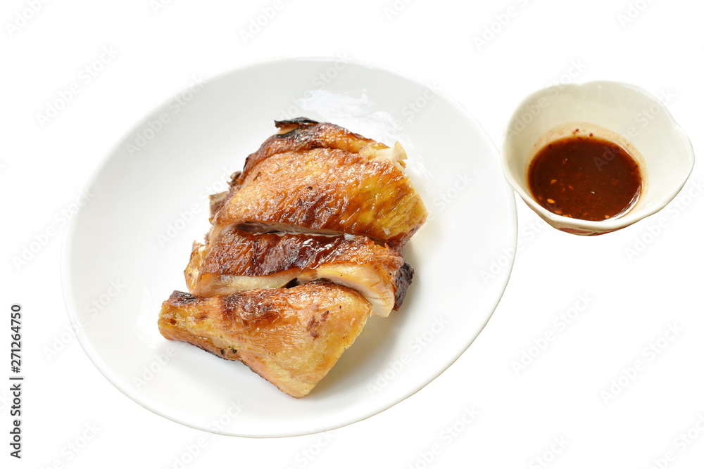 grilled chicken cutting on plate dipping with spicy sauce