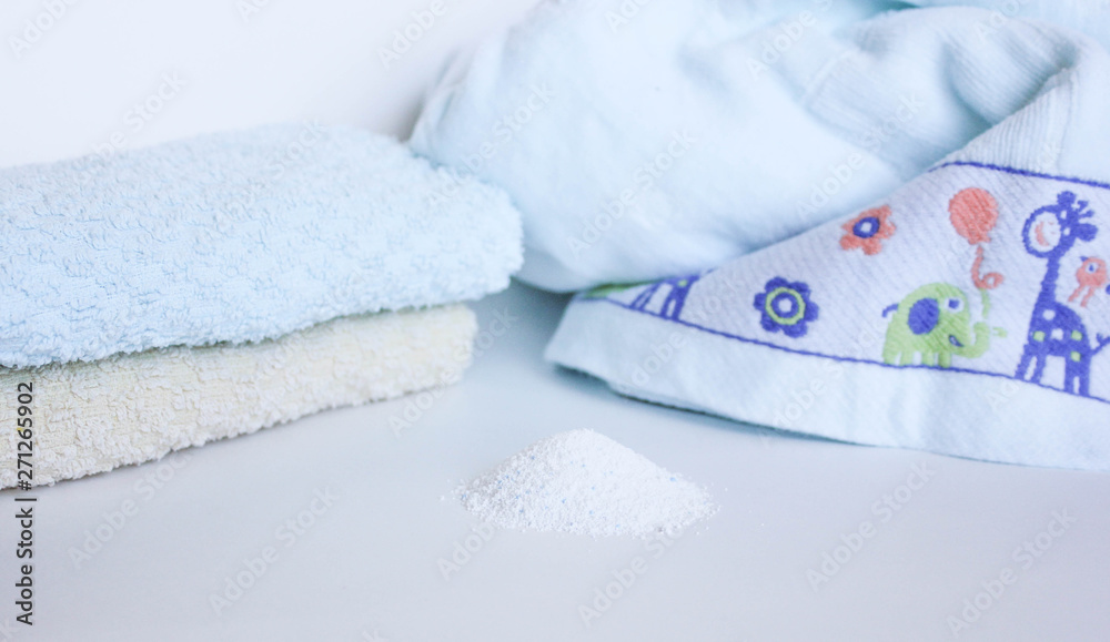  washing powder on a white background with towels