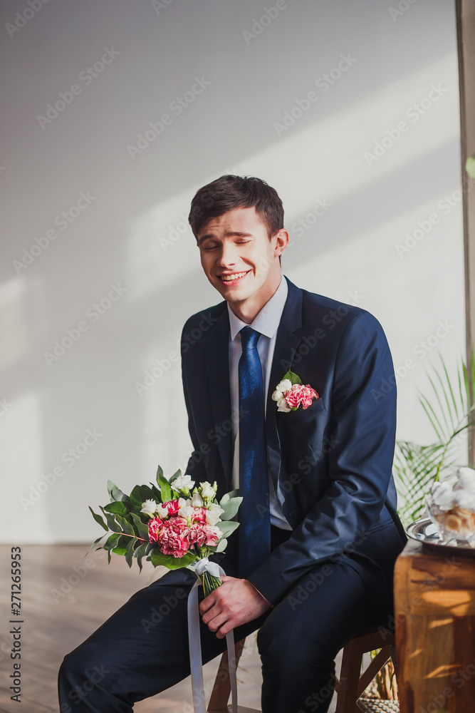 the groom with a bouquet in the room shows different emotions