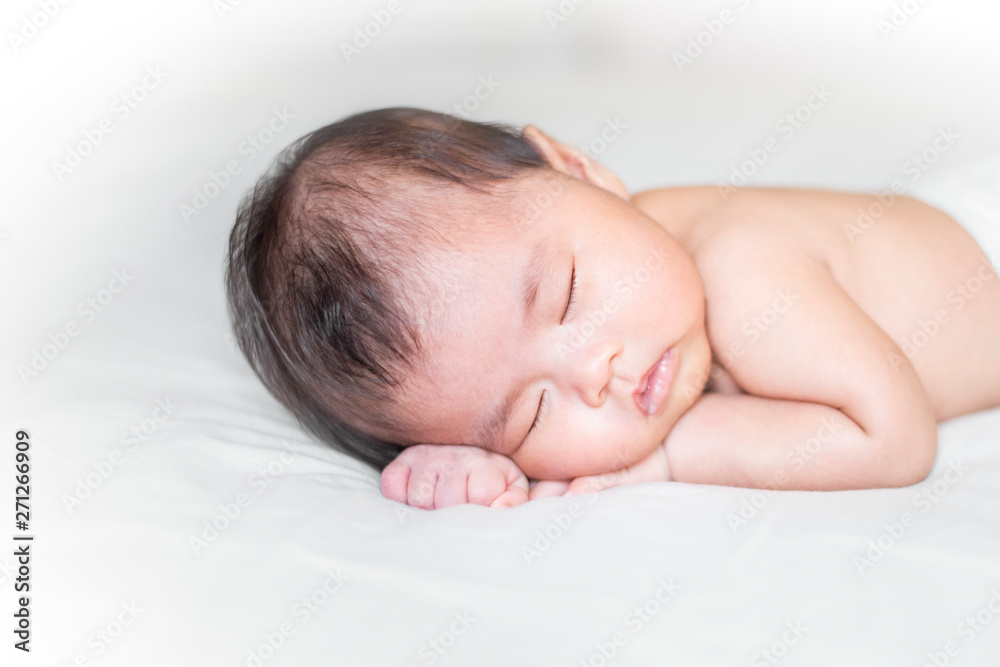 cute newborn baby is sleeping on white bed cute newborn baby is sleeping on white bed