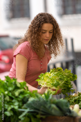 Young woman at the vegetable food market 