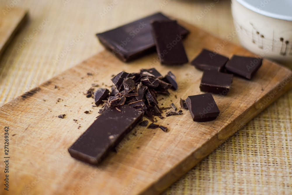 Cut chocolate on the wooden board Cut chocolate on the wooden board