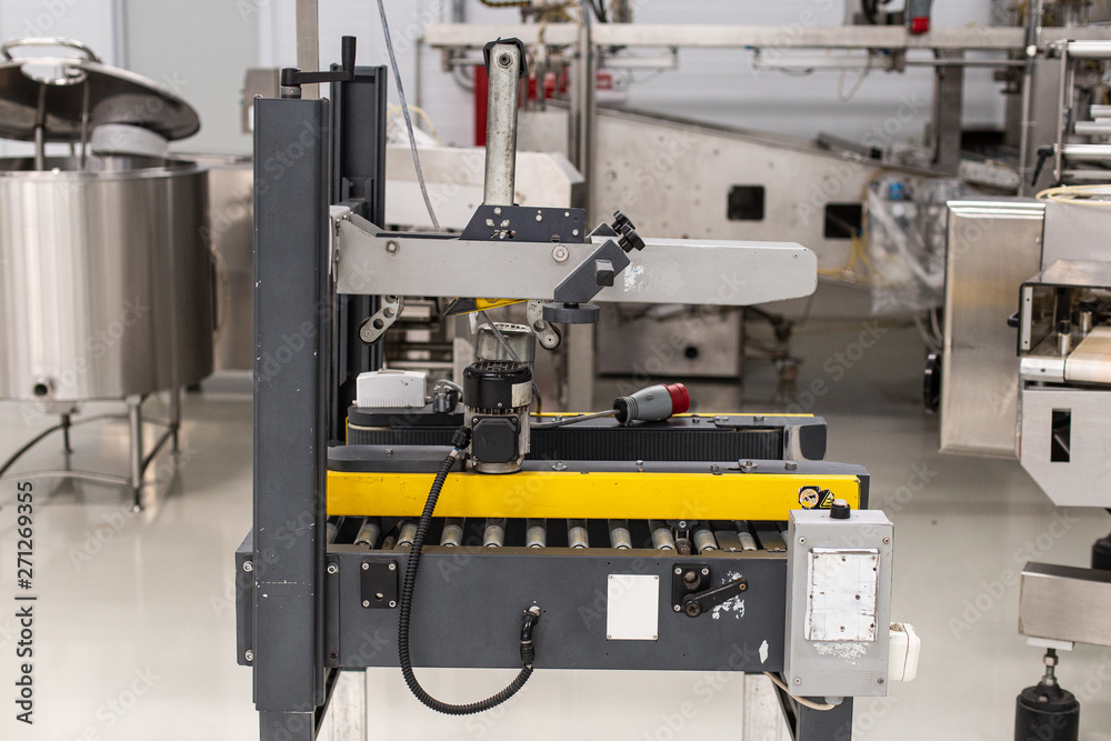 Ice cream production line. Conveyor production. Machine for conveyor line. Selective focus. Ice cream production line. Conveyor production. Machine for conveyor line. Selective focus.