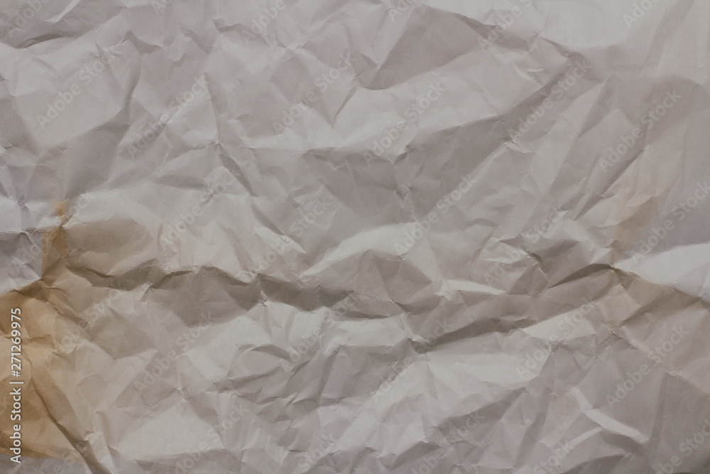 Obraz premium Old crumpled paper texture background. Creases and cracks. Old design pattern. 